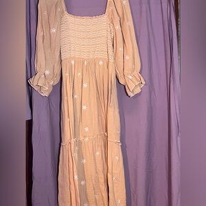 Tan flowing dress with flowers on it